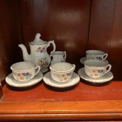 L1216 Four Shelves of Vintage Children's China Dishes