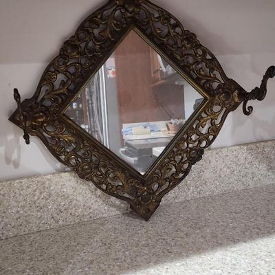 Mirror with coat hooks