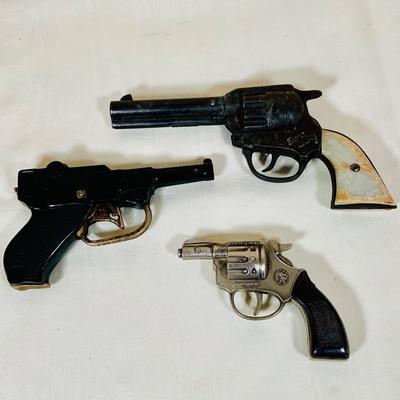 LOT 28: Collection of Three (3) Vintage Toy Cap Guns -Conher, Gene Autry and More