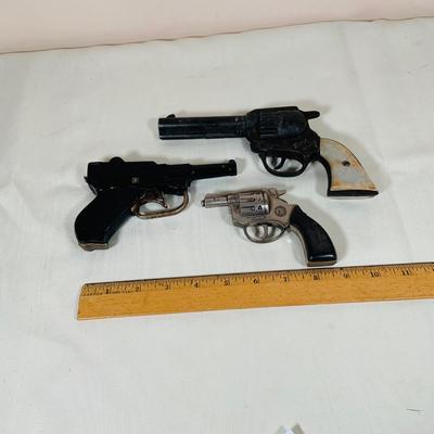 LOT 28: Collection of Three (3) Vintage Toy Cap Guns -Conher, Gene Autry and More