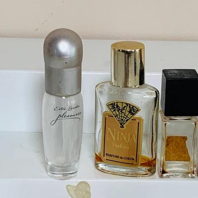 LOT 43; Large Assortment of Mini. Perfume Bottles by Isadora, Shalimar, Guerlain, and More