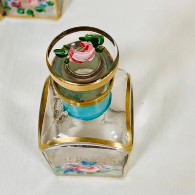 LOT 44: Vintage Vanity Necessity Including Hand Painted Glass Bottles, Metal Power Bottles, a Ceramic Jaw with Mirror Lid and More