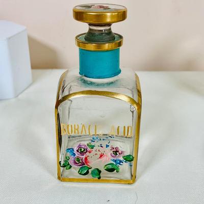 LOT 44: Vintage Vanity Necessity Including Hand Painted Glass Bottles, Metal Power Bottles, a Ceramic Jaw with Mirror Lid and More