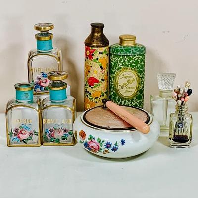 LOT 44: Vintage Vanity Necessity Including Hand Painted Glass Bottles, Metal Power Bottles, a Ceramic Jaw with Mirror Lid and More