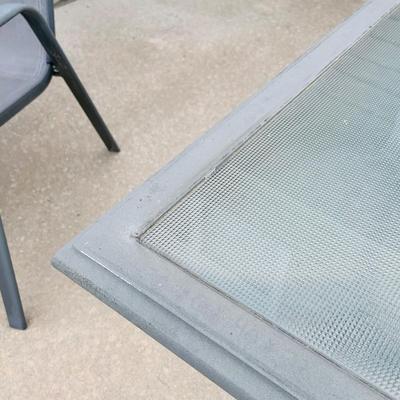 LOT 46: Outdoor Glass Top Table and Four Chairs