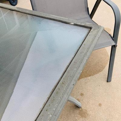 LOT 46: Outdoor Glass Top Table and Four Chairs