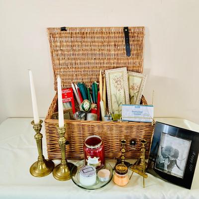 LOT 52: Basketful of Candles, Frames and Display Easels and Brass Candle Sticks and More