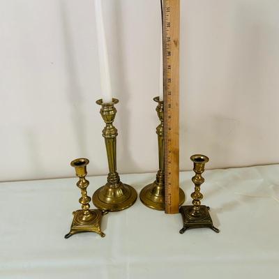 LOT 52: Basketful of Candles, Frames and Display Easels and Brass Candle Sticks and More