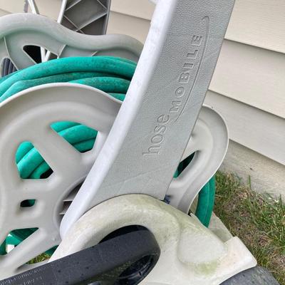 LOT 60: Lawn and Garden - Hose and Hose Mobile Holder, Rakes, Step 2 Rolling Garden Cart / Seat with Contents and More