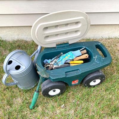 LOT 60: Lawn and Garden - Hose and Hose Mobile Holder, Rakes, Step 2 Rolling Garden Cart / Seat with Contents and More