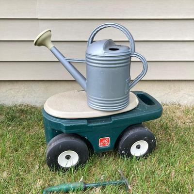 LOT 60: Lawn and Garden - Hose and Hose Mobile Holder, Rakes, Step 2 Rolling Garden Cart / Seat with Contents and More