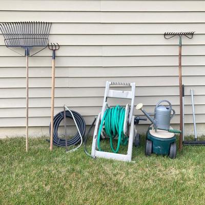 LOT 60: Lawn and Garden - Hose and Hose Mobile Holder, Rakes, Step 2 Rolling Garden Cart / Seat with Contents and More