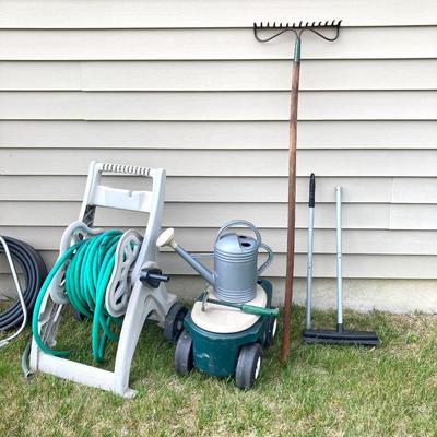 LOT 60: Lawn and Garden - Hose and Hose Mobile Holder, Rakes, Step 2 Rolling Garden Cart / Seat with Contents and More