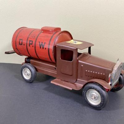 LOT 68: Shell Oil Metal Truck with Miniature Oil Drums and D.P.W. Oil Delivery Truck (Metalcraft Gearbox)
