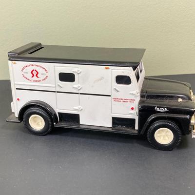 LOT 77: Deepwater Industries Federal Credit Union Diecast Armored Truck Bank, Oversized One Cent Bank and Hand Crafted Metal Brinks Truck