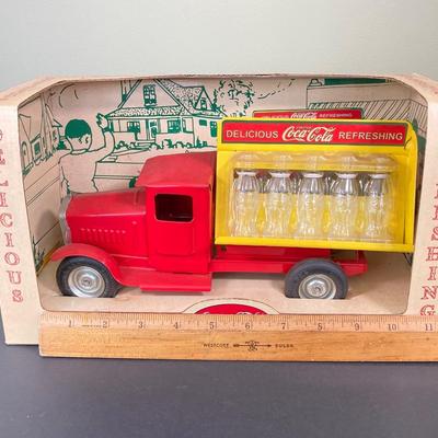 LOT 78: 1930's Coca-Cola Metal Toy Truck in Original Box (Gearbox) with Extra Bottles