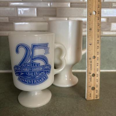 LOT 90: Glass Collection with Avocado Green Glass Mugs, Amber Glass Mug, Milk Glass, 25th Harley Davidson Mug, Coca-Cola Glasses, Cowtown...