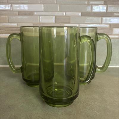 LOT 90: Glass Collection with Avocado Green Glass Mugs, Amber Glass Mug, Milk Glass, 25th Harley Davidson Mug, Coca-Cola Glasses, Cowtown...
