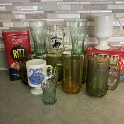 LOT 90: Glass Collection with Avocado Green Glass Mugs, Amber Glass Mug, Milk Glass, 25th Harley Davidson Mug, Coca-Cola Glasses, Cowtown...