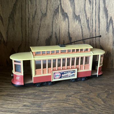 LOT 95: Cable/Streetcar Model Collection: City Transport, IDM by UMD Inc., Heinz 57 Trolly Bank & Tin Toy Trolly Ornament