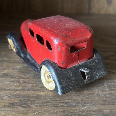 LOT 97: Cast Iron (3) and Tin Toy Car (1