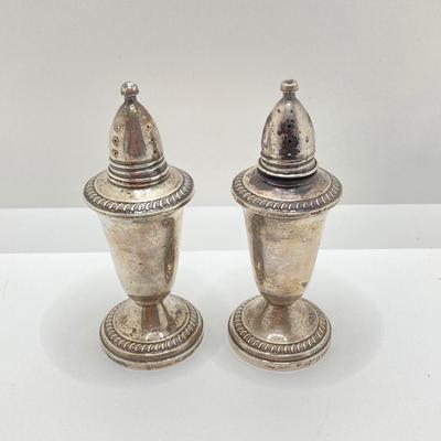 LOT 179: Weighted Sterling Salt and Pepper Shakers and Four Sterling Round Coasters