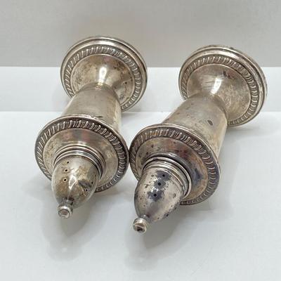 LOT 179: Weighted Sterling Salt and Pepper Shakers and Four Sterling Round Coasters