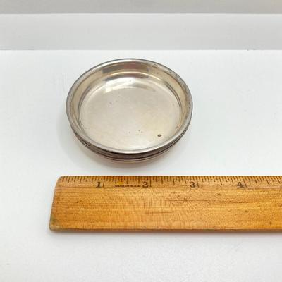 LOT 179: Weighted Sterling Salt and Pepper Shakers and Four Sterling Round Coasters