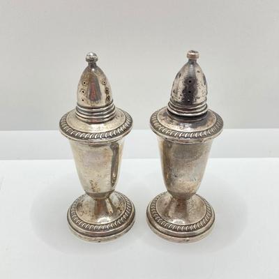 LOT 179: Weighted Sterling Salt and Pepper Shakers and Four Sterling Round Coasters