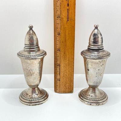LOT 179: Weighted Sterling Salt and Pepper Shakers and Four Sterling Round Coasters