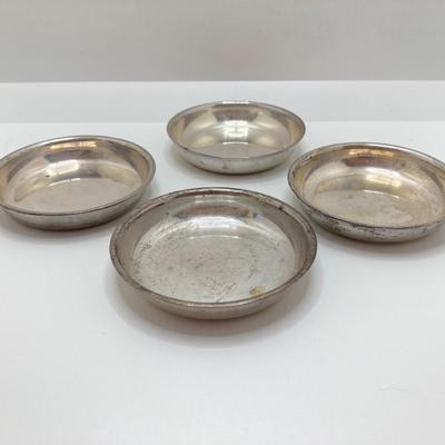 LOT 179: Weighted Sterling Salt and Pepper Shakers and Four Sterling Round Coasters
