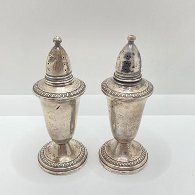 LOT 179: Weighted Sterling Salt and Pepper Shakers and Four Sterling Round Coasters
