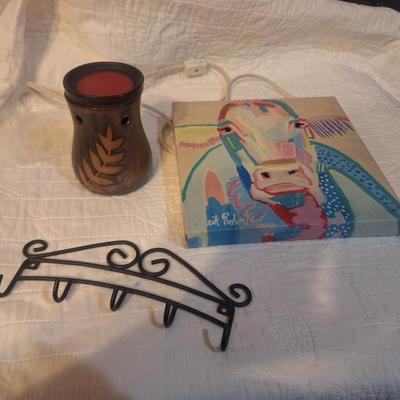 Sale Photo Thumbnail #40: Key hooks, small painting of a cow and a scent warmer that probably needs a new bulb