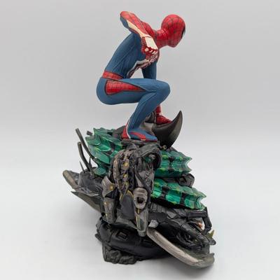 LOT 104: Captain America Tumbler, Marvel Vs. Capcom Diorama Figure, Mega Man, Spider Man Statues & Infinite Collector's Edition...