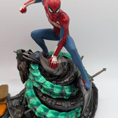 LOT 104: Captain America Tumbler, Marvel Vs. Capcom Diorama Figure, Mega Man, Spider Man Statues & Infinite Collector's Edition...