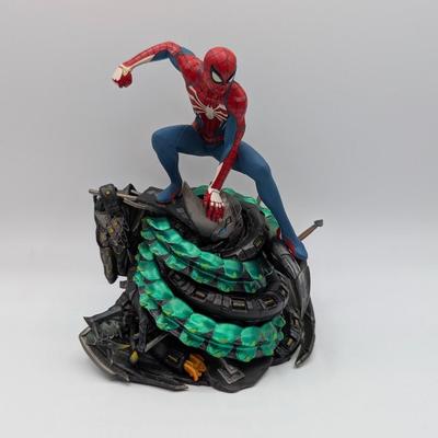 LOT 104: Captain America Tumbler, Marvel Vs. Capcom Diorama Figure, Mega Man, Spider Man Statues & Infinite Collector's Edition...