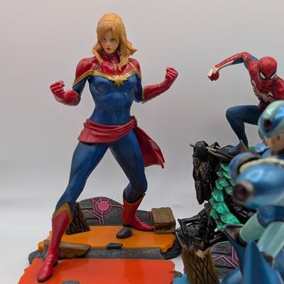 LOT 104: Captain America Tumbler, Marvel Vs. Capcom Diorama Figure, Mega Man, Spider Man Statues & Infinite Collector's Edition...