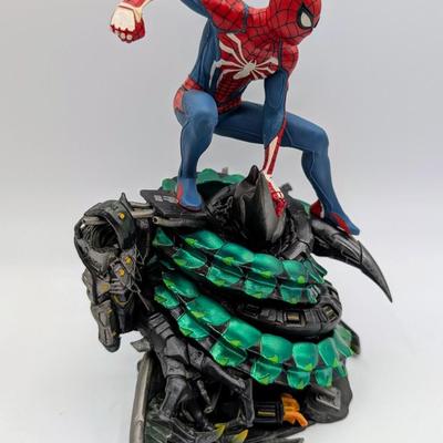 LOT 104: Captain America Tumbler, Marvel Vs. Capcom Diorama Figure, Mega Man, Spider Man Statues & Infinite Collector's Edition...