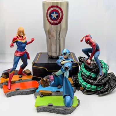 LOT 104: Captain America Tumbler, Marvel Vs. Capcom Diorama Figure, Mega Man, Spider Man Statues & Infinite Collector's Edition...