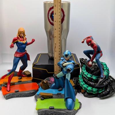LOT 104: Captain America Tumbler, Marvel Vs. Capcom Diorama Figure, Mega Man, Spider Man Statues & Infinite Collector's Edition...