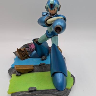 LOT 104: Captain America Tumbler, Marvel Vs. Capcom Diorama Figure, Mega Man, Spider Man Statues & Infinite Collector's Edition...