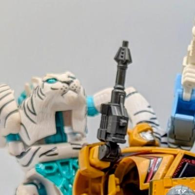 LOT 108: Transformers Generations Legacy Titan Cybertron & A Large Assortment Of Other Transformer Action Figures.