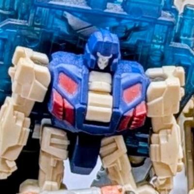 LOT 108: Transformers Generations Legacy Titan Cybertron & A Large Assortment Of Other Transformer Action Figures.