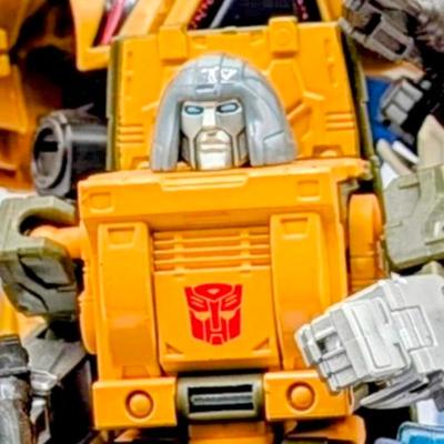 LOT 108: Transformers Generations Legacy Titan Cybertron & A Large Assortment Of Other Transformer Action Figures.