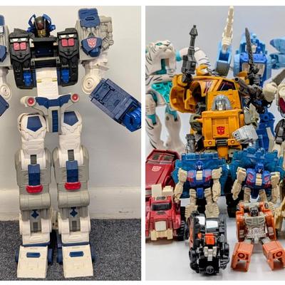 LOT 108: Transformers Generations Legacy Titan Cybertron & A Large Assortment Of Other Transformer Action Figures.
