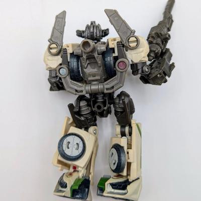 LOT 108: Transformers Generations Legacy Titan Cybertron & A Large Assortment Of Other Transformer Action Figures.