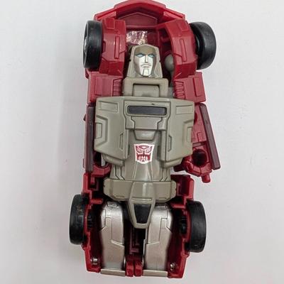LOT 108: Transformers Generations Legacy Titan Cybertron & A Large Assortment Of Other Transformer Action Figures.