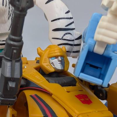 LOT 108: Transformers Generations Legacy Titan Cybertron & A Large Assortment Of Other Transformer Action Figures.