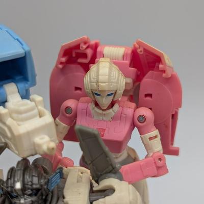LOT 108: Transformers Generations Legacy Titan Cybertron & A Large Assortment Of Other Transformer Action Figures.