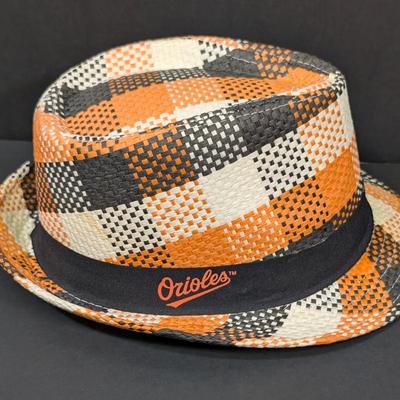 LOT 228: Baltimore Oriole Gear, Button Down Shortsleeve Shirt, Pullover, Sweatshirt, 2 Straw Hats, One Signed & 3 Baseball Caps. No...